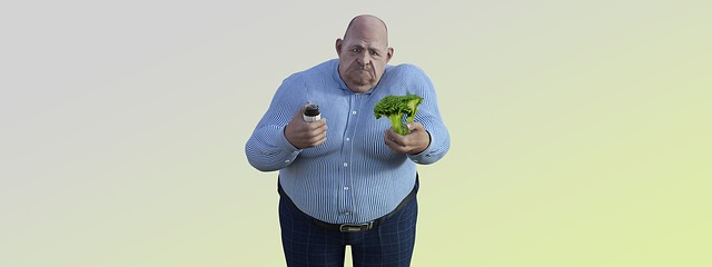 obese bald man holding with hypothyroidism